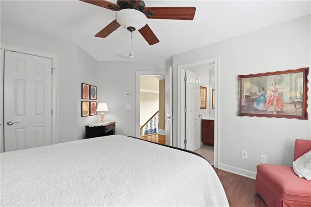 a white toilet sitting next to a bathroom sink