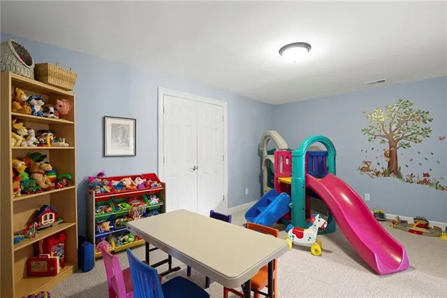 an aerial view of a house with yard and parking