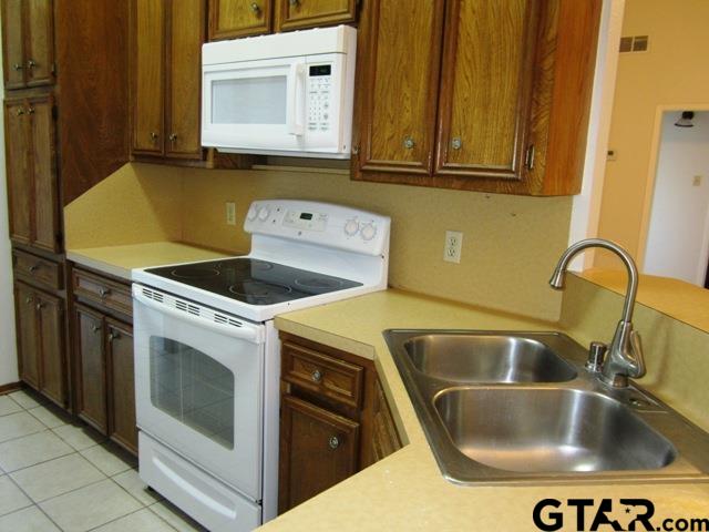 103 Wendy Whitehouse, TX 75791 - Photo 7 of 18 a close view of sink and washing machine