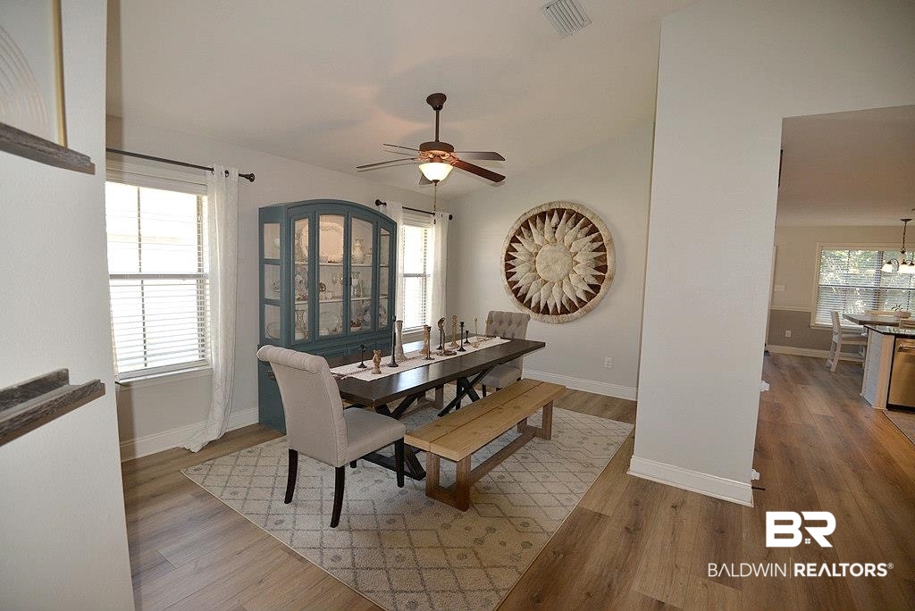 11201 Herschel Loop Daphne, AL 36526 - Photo 10 of 32 Dining room with ceiling fan and wood-type flooring