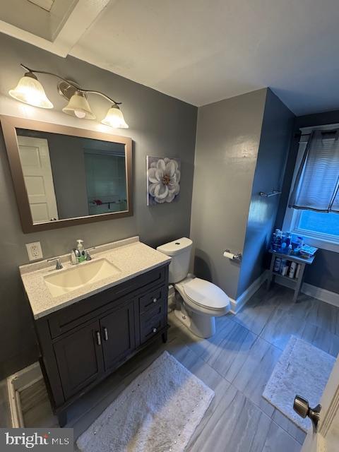 213 Church Street Newfield, NJ 08344 - Photo 29 of 36 a bathroom with a toilet sink and mirror