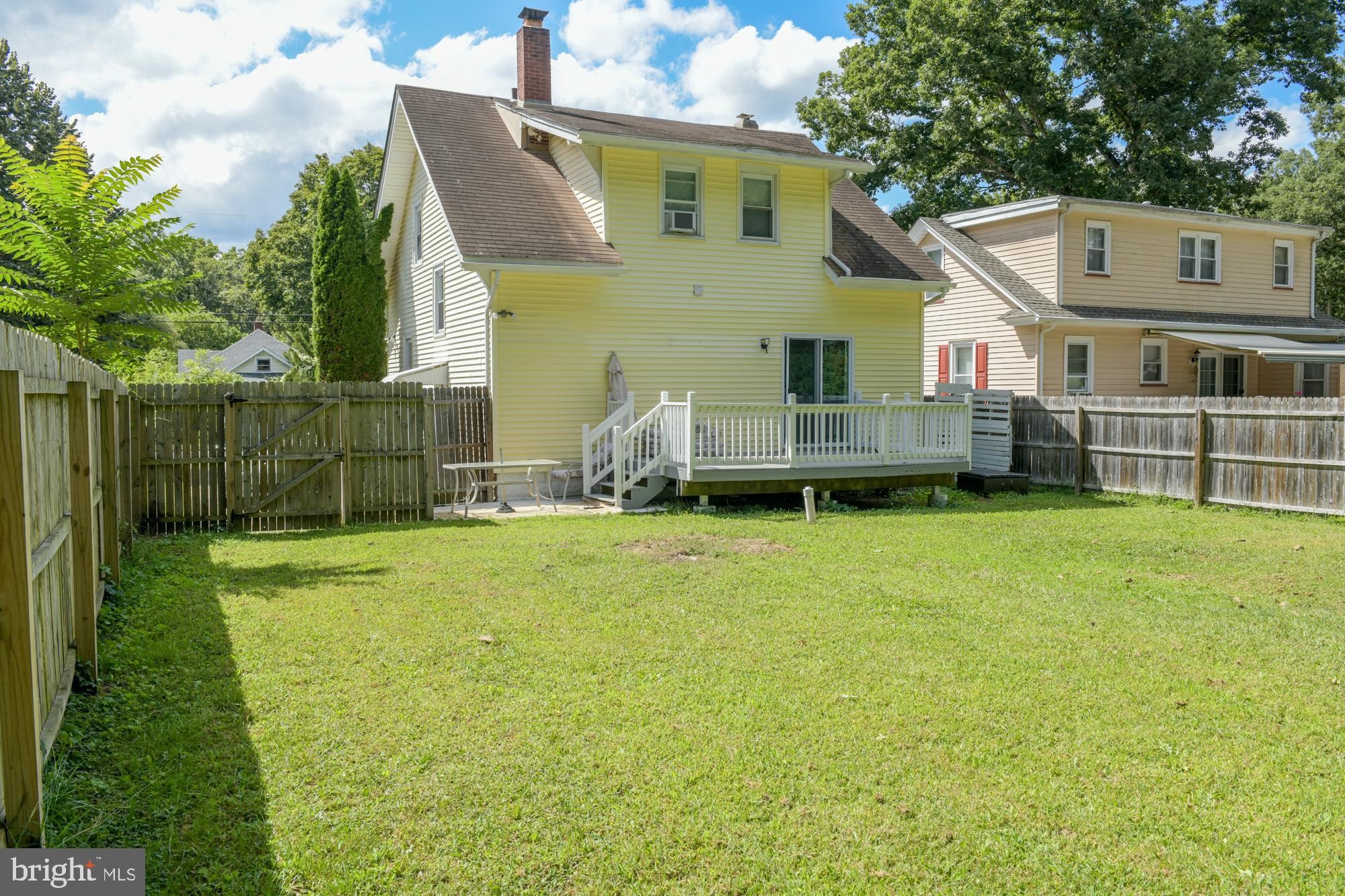 213 Church Street Newfield, NJ 08344 - Photo 6 of 36 a view of a house with a backyard