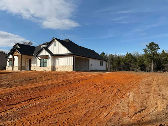 a house with trees in the background