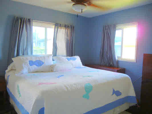 4800 Nonou Road Kapaa, HI 96746 - Photo 14 of 20 a bedroom with a bed and a window