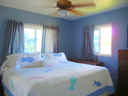 4800 Nonou Road Kapaa, HI 96746 - Photo 16 of 20 a bedroom with a bed and window