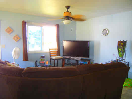 4800 Nonou Road Kapaa, HI 96746 - Photo 9 of 20 a living room with furniture and a flat screen tv