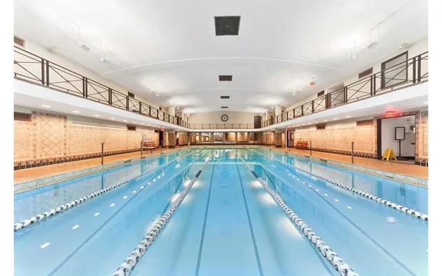 a room with gym equipment and a large window