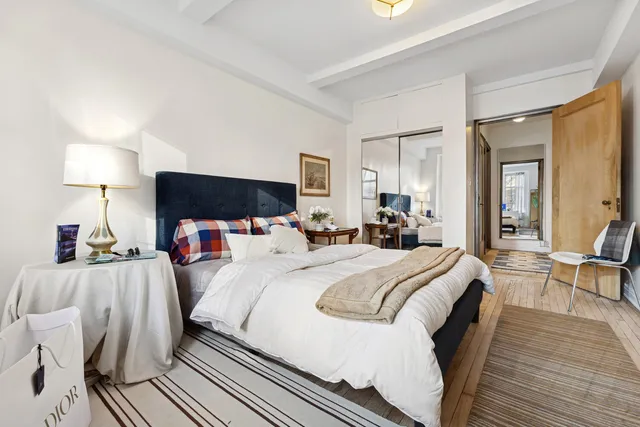 a living room with furniture and a rug
