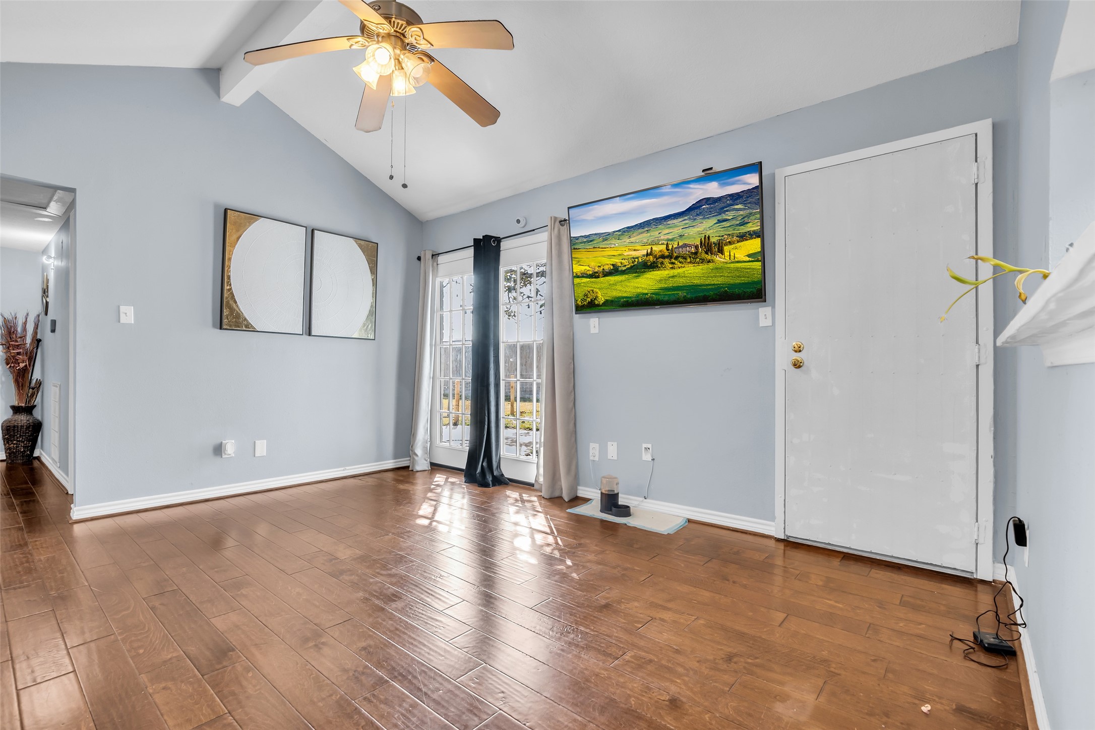 10730 Filey Lane Houston, TX 77013 - Photo 13 of 25 Another view of the flex space that leads to the backyard and the other door is for the laundry room.