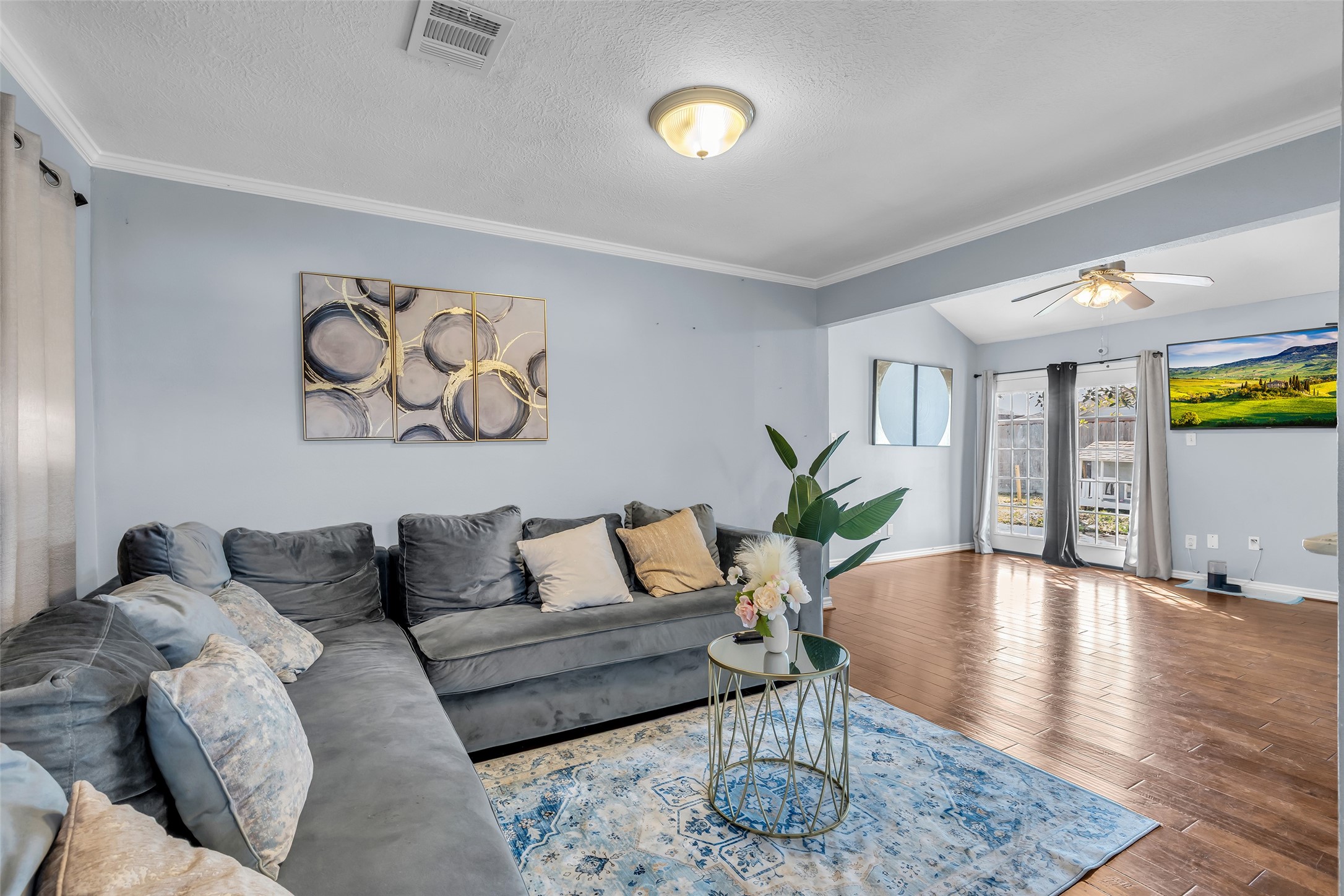 10730 Filey Lane Houston, TX 77013 - Photo 21 of 25 Another view of the spacious living room that connects to a flex space that can be used for dining or a home office.