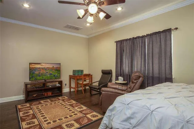 a bed room with a bed and a television