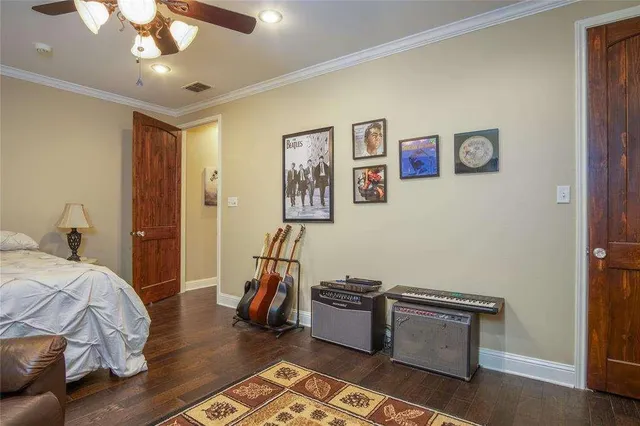 a view of a bedroom with bed and workspace
