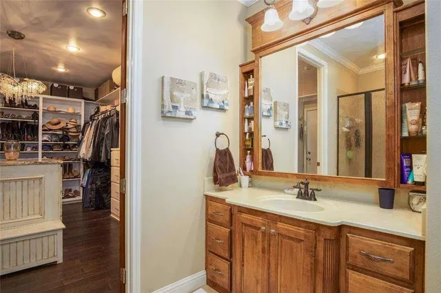 a bathroom with a double vanity sink and a mirror