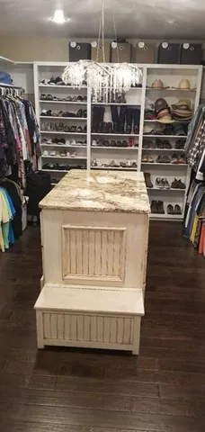 a room with water heater and wooden racks