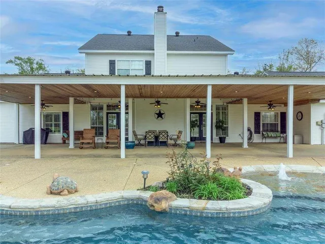 front view of a house with a swimming pool