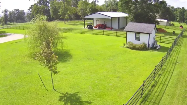 a view of a swimming pool with a garden