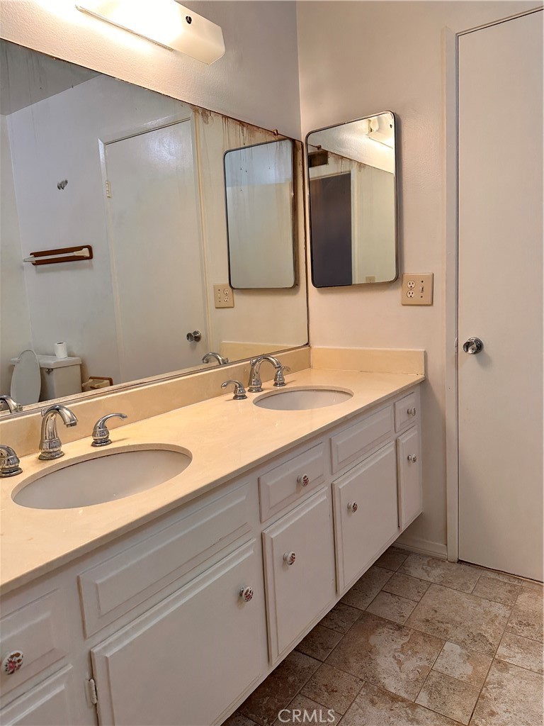 23712 Highlander Road West Hills, CA 91307 - Photo 12 of 21 a bathroom with a double vanity sink and mirror
