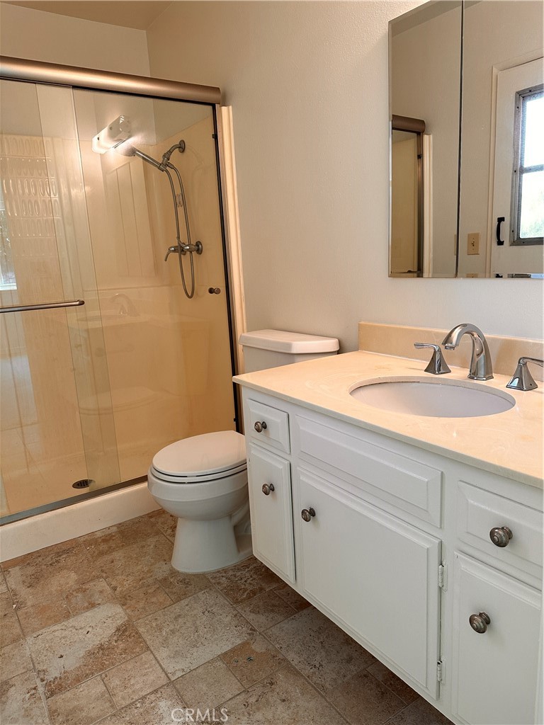 23712 Highlander Road West Hills, CA 91307 - Photo 17 of 21 a bathroom with a toilet sink and shower