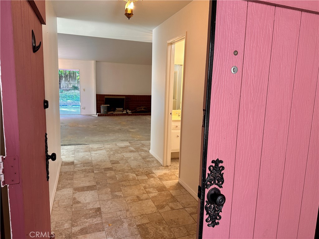 23712 Highlander Road West Hills, CA 91307 - Photo 4 of 21 an entryway of a house and an empty room