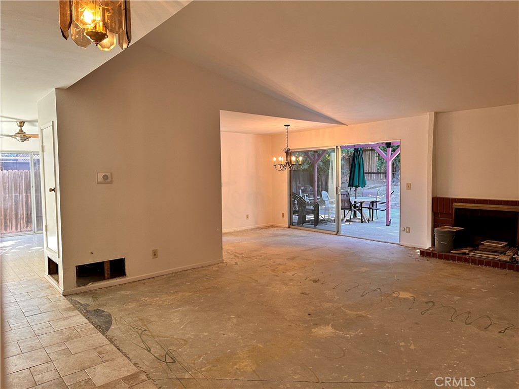 23712 Highlander Road West Hills, CA 91307 - Photo 7 of 21 a view of a livingroom with furniture and a fireplace