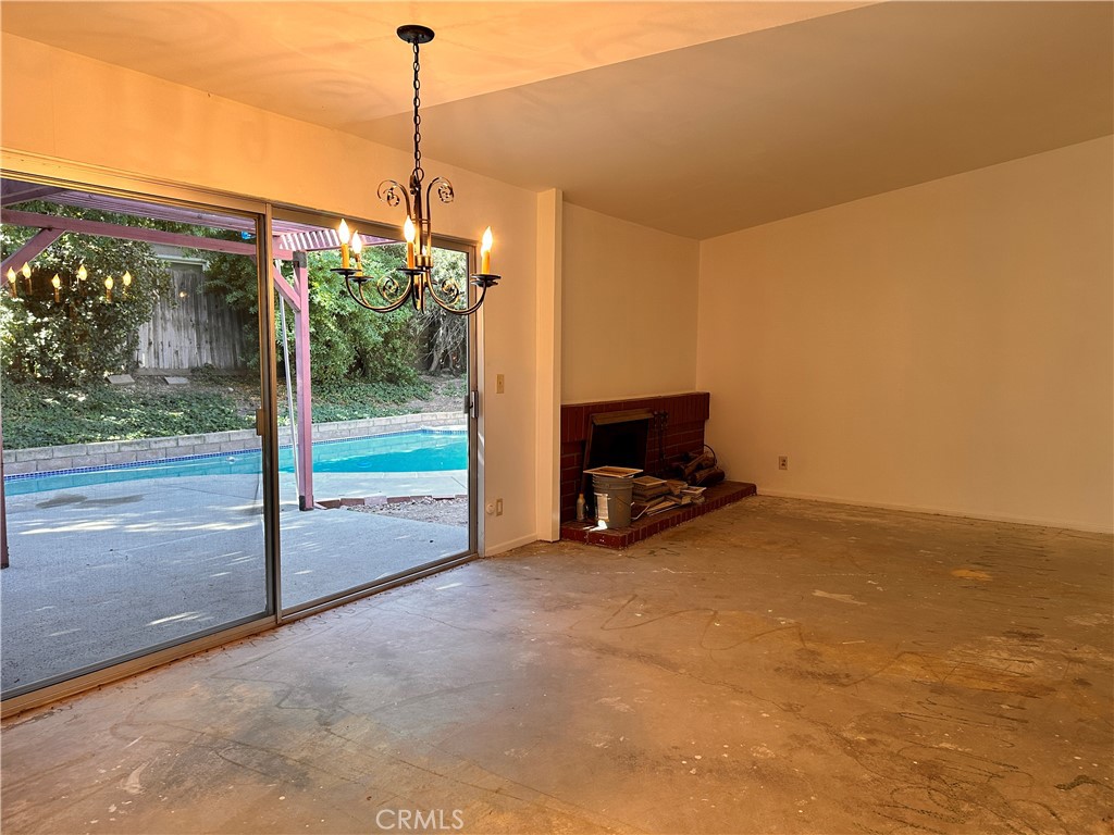 23712 Highlander Road West Hills, CA 91307 - Photo 8 of 21 a view of a room with a flat screen tv