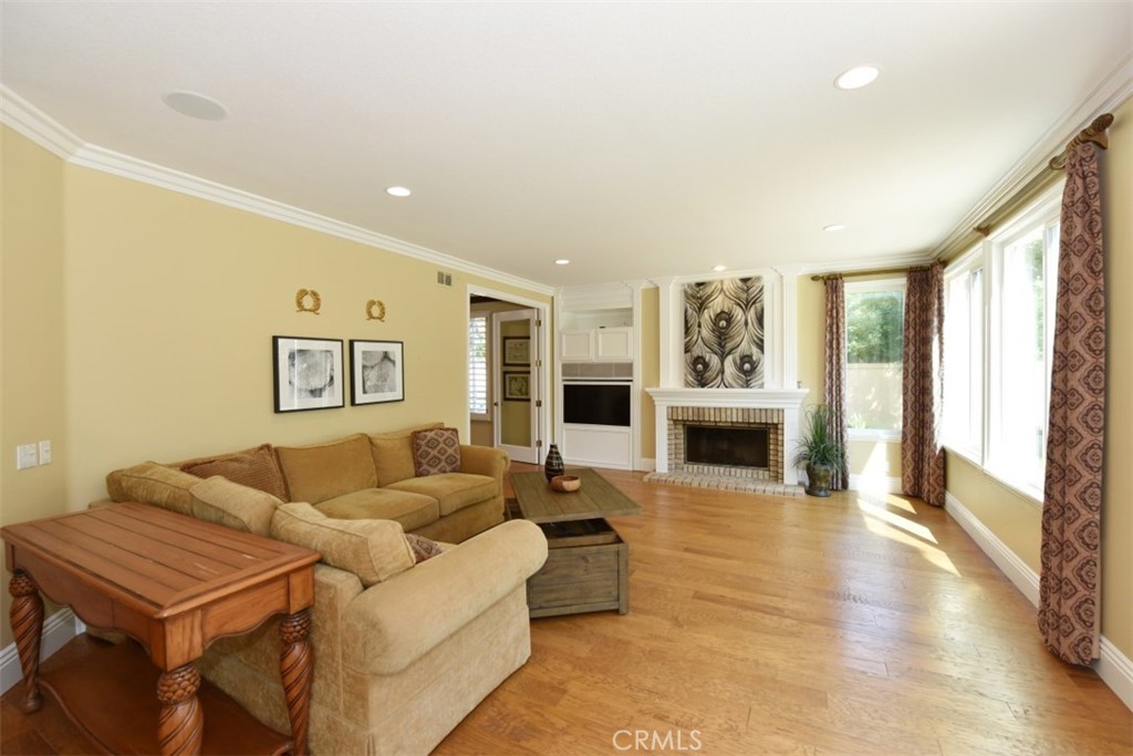 12 Brigadier Irvine, CA 92603 - Photo 24 of 50 a living room with furniture and a fireplace