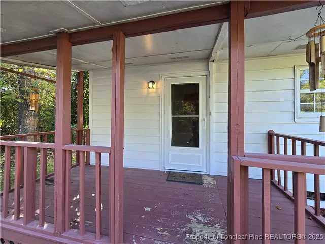 a view of balcony with wooden floor