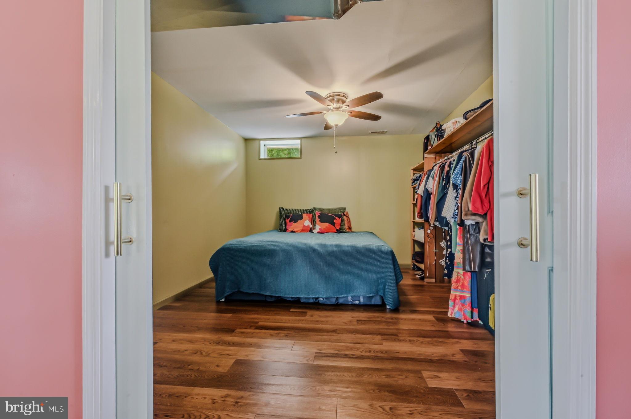 210 Elk View Road North East, MD 21901 - Photo 24 of 64 a bedroom with a bed and a chandelier