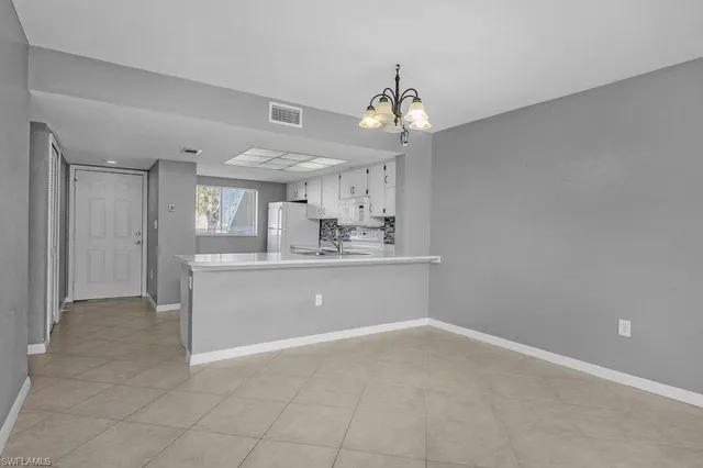a view of kitchen and windows