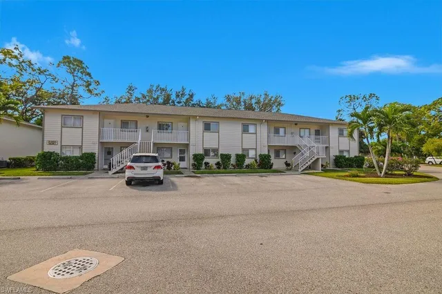 a view of a car parked in front of a house