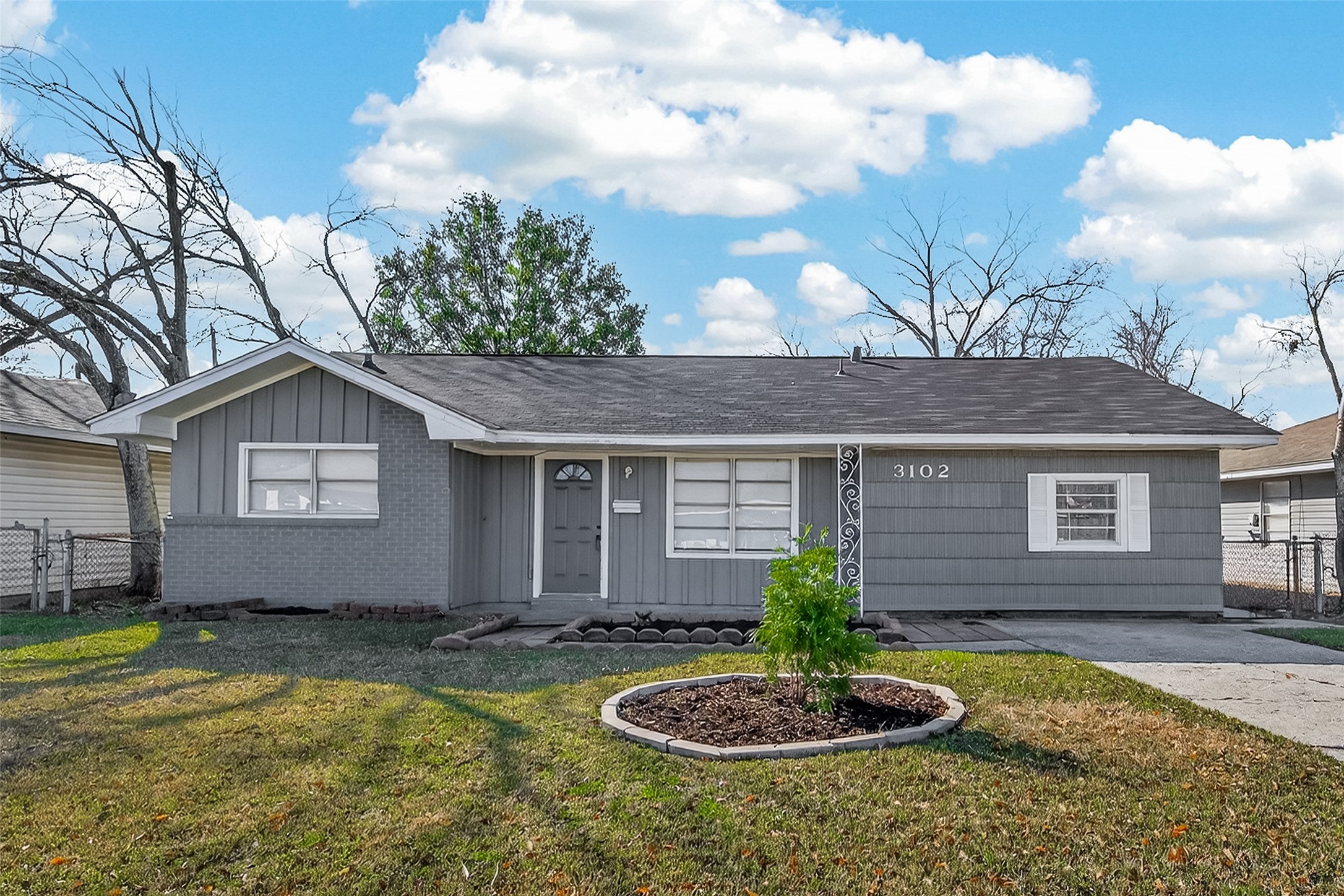3102 Hays Street Pasadena, TX 77503 - Photo 1 of 25 a front view of house with yard and trees around