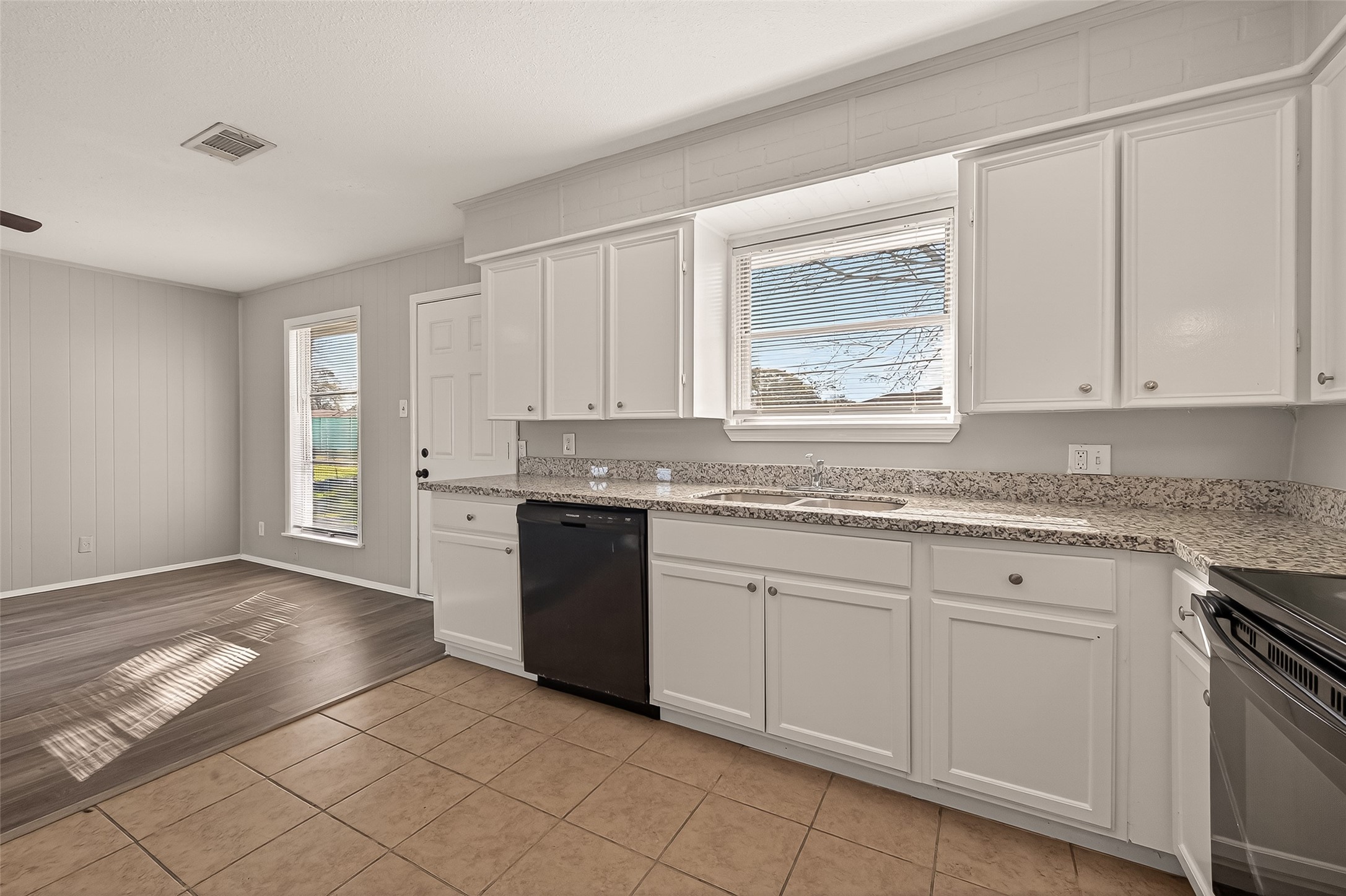 3102 Hays Street Pasadena, TX 77503 - Photo 15 of 25 a white kitchen with granite countertop cabinets and a sink