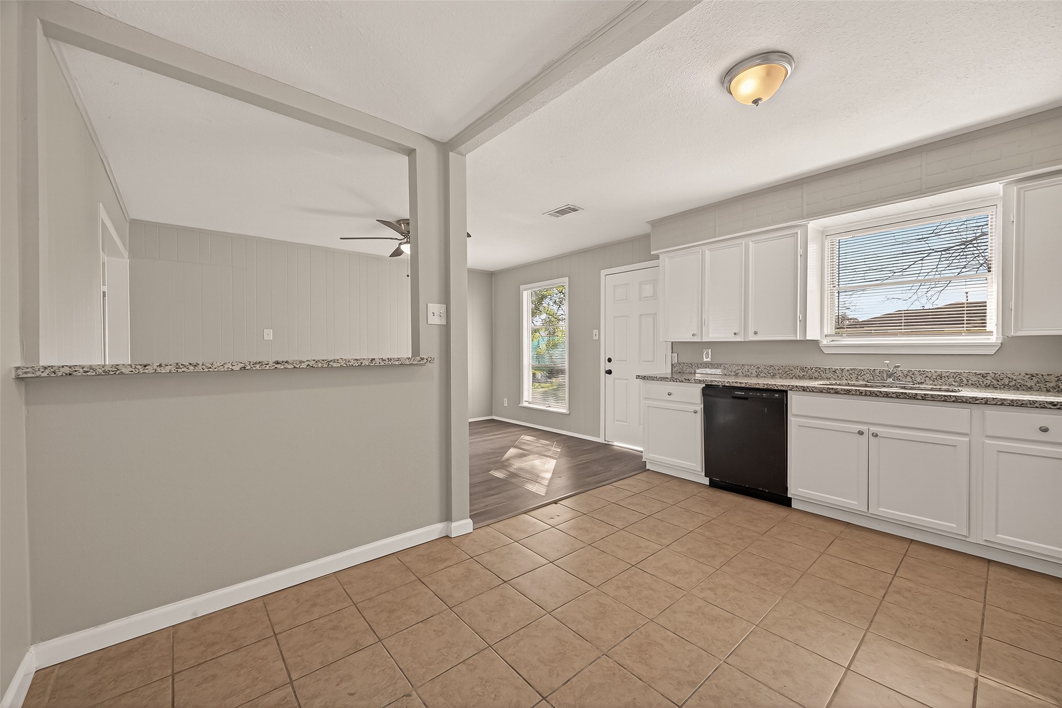3102 Hays Street Pasadena, TX 77503 - Photo 17 of 25 a large white kitchen with granite countertop a sink
