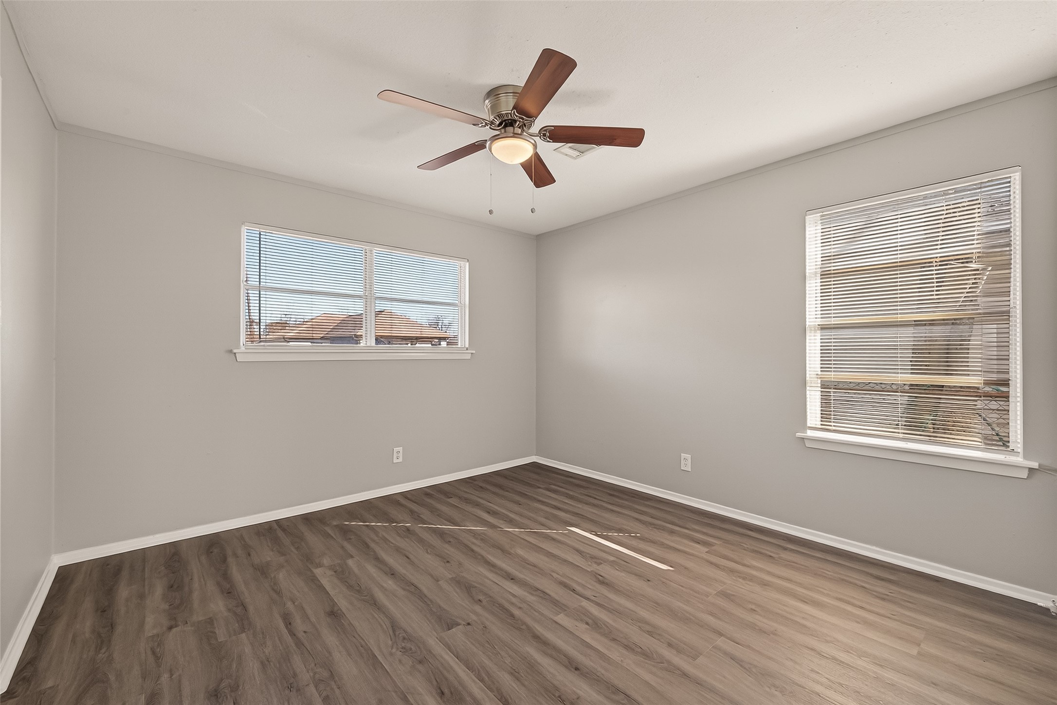 3102 Hays Street Pasadena, TX 77503 - Photo 22 of 25 wooden floor in an empty room with a window