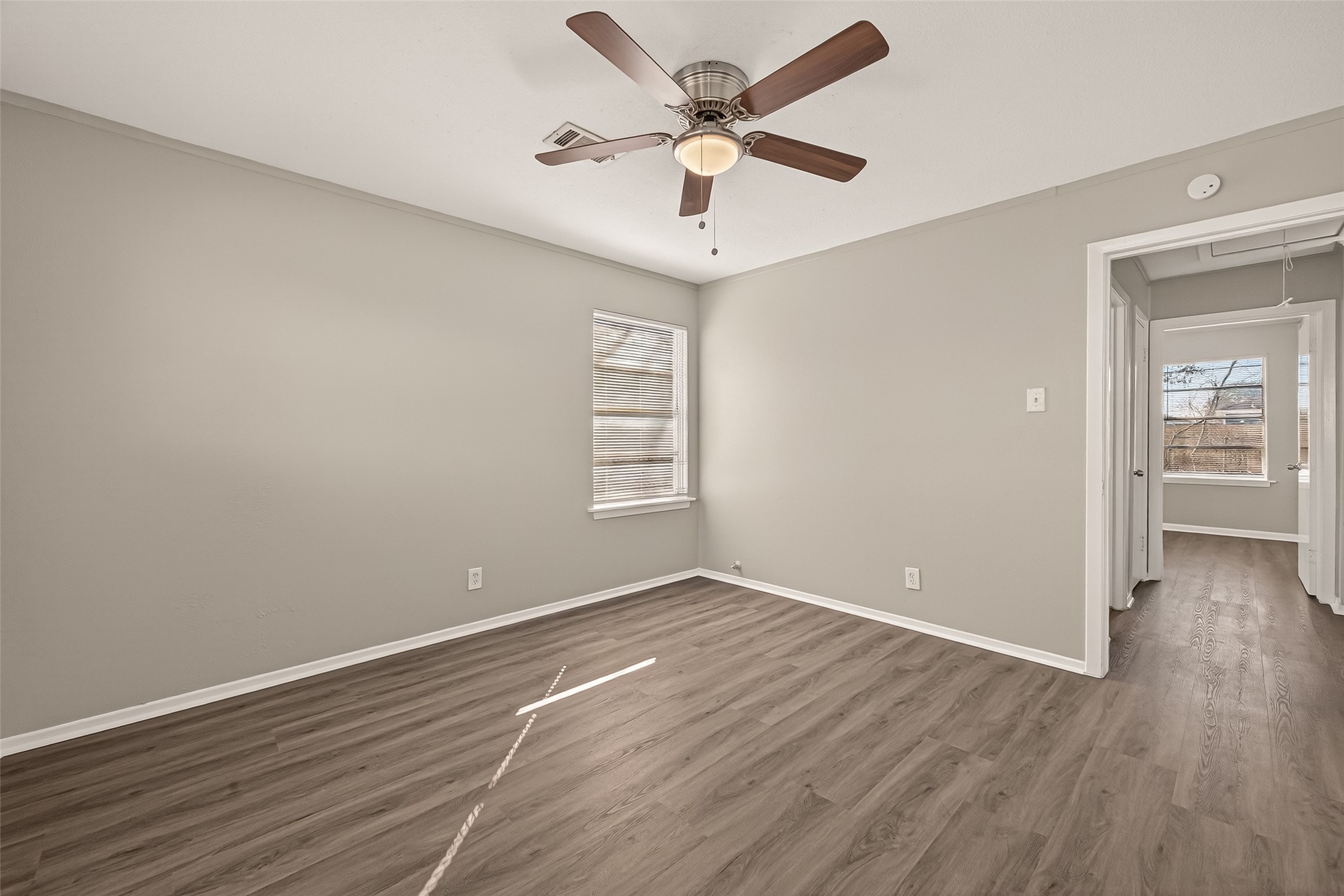 3102 Hays Street Pasadena, TX 77503 - Photo 23 of 25 wooden floor in an empty room with a window
