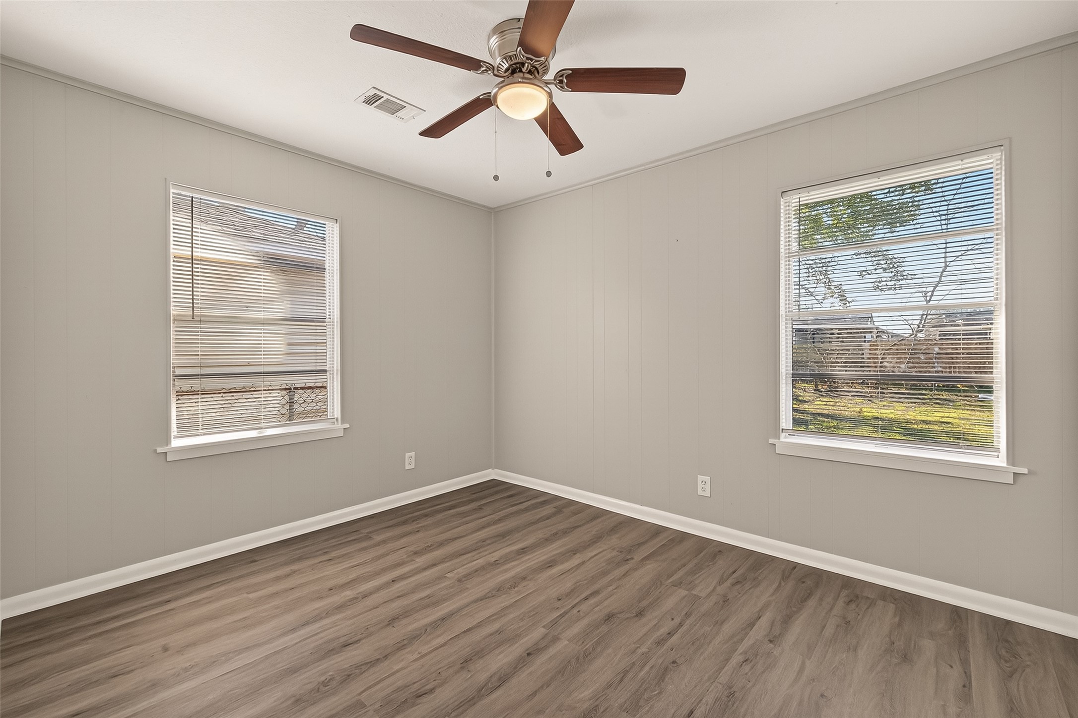 3102 Hays Street Pasadena, TX 77503 - Photo 25 of 25 a view of an empty room with wooden floor and a window