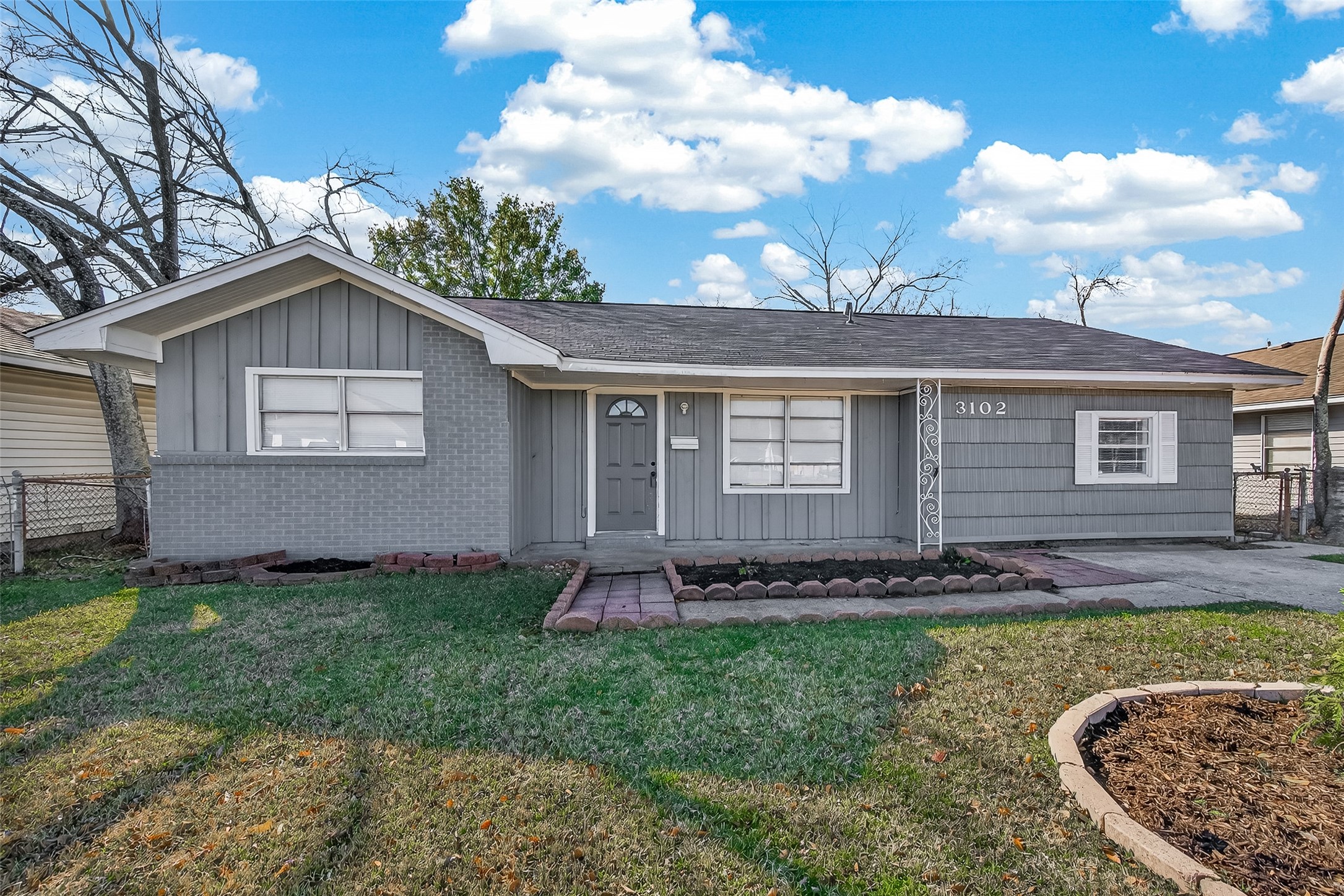 3102 Hays Street Pasadena, TX 77503 - Photo 3 of 25 a front view of a house with a yard
