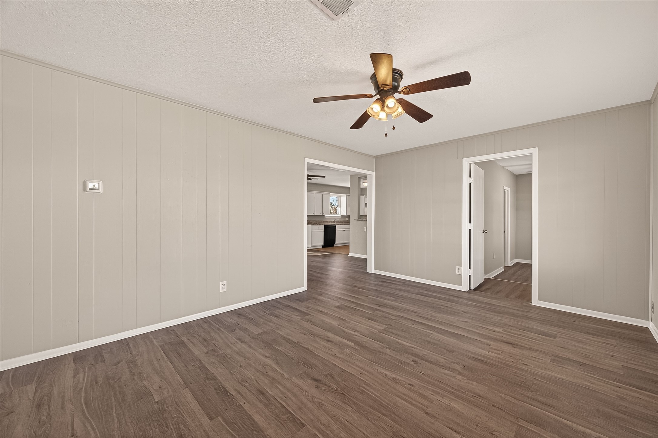 3102 Hays Street Pasadena, TX 77503 - Photo 8 of 25 a view of empty room with wooden floor and ceiling fan