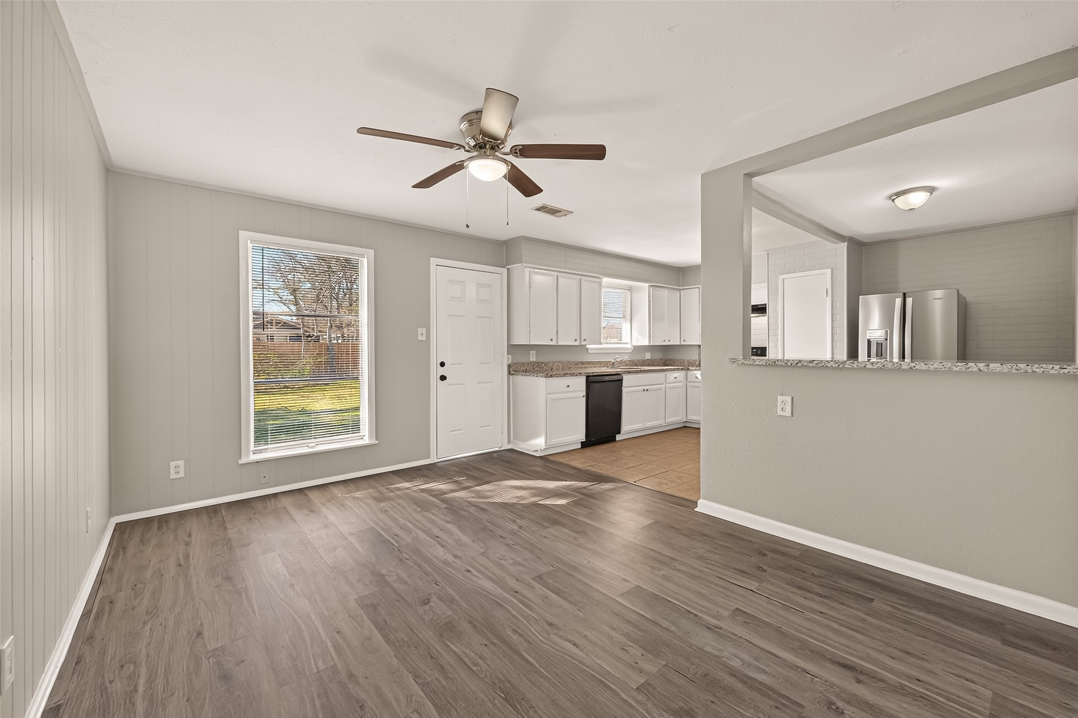 3102 Hays Street Pasadena, TX 77503 - Photo 10 of 25 a view of a kitchen with a dishwasher cabinets and wooden floor