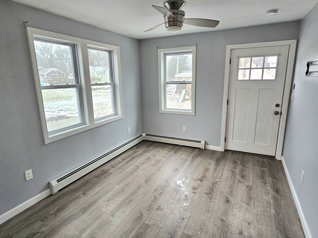 5 William Street Acushnet, MA 02743 - Photo 11 of 20 a view of an empty room with a window and wooden floor