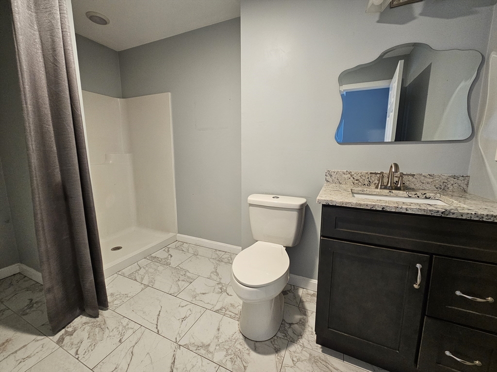 5 William Street Acushnet, MA 02743 - Photo 13 of 20 a bathroom with a sink and a toilet