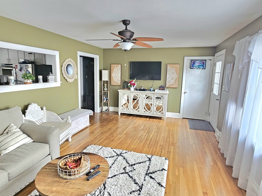 5 William Street Acushnet, MA 02743 - Photo 2 of 20 a bedroom with furniture and a wooden floor
