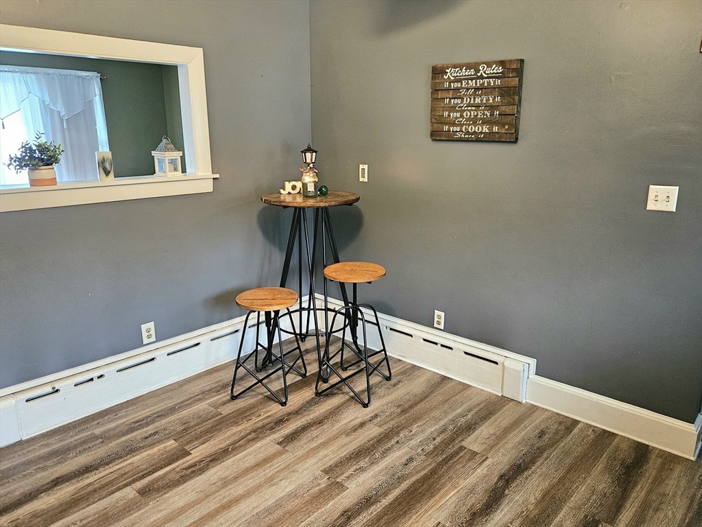 5 William Street Acushnet, MA 02743 - Photo 6 of 20 a room with a table and a painting on the wall