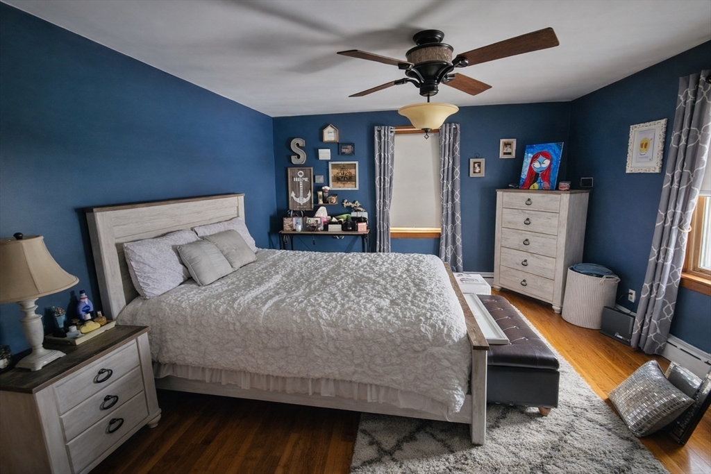 5 William Street Acushnet, MA 02743 - Photo 8 of 20 a bedroom with a bed and a flat tv screen on the dresser