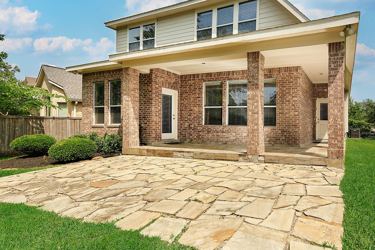 35 Granite Path Place Spring, TX 77389 - Photo 24 of 40 Wrap Around Covered Patio and Extended Stone Decking
