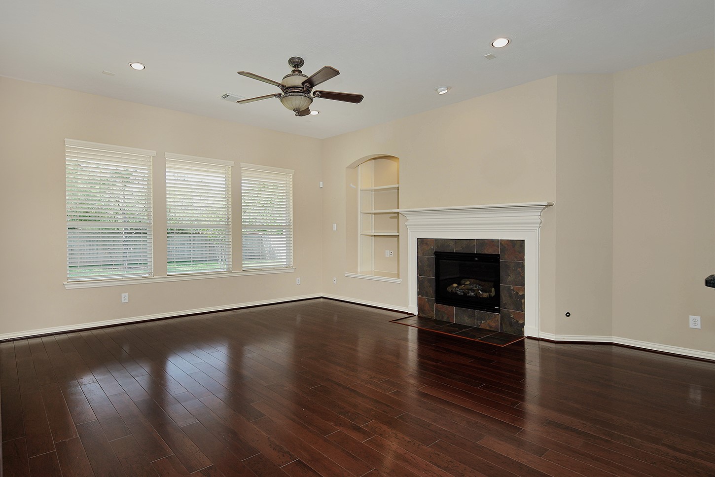 35 Granite Path Place Spring, TX 77389 - Photo 8 of 40 Family Room with Fireplace and Wall of Windows