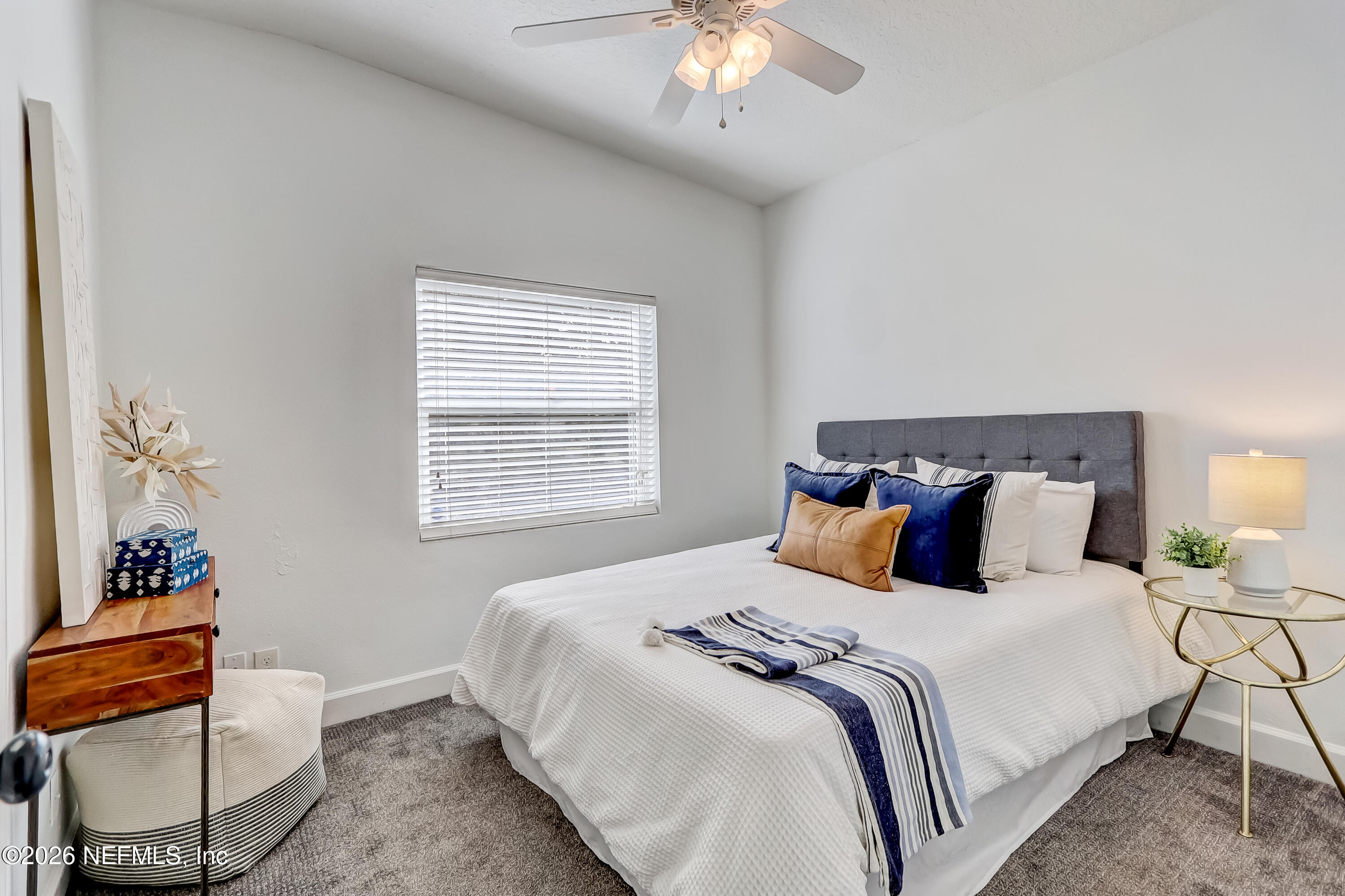 2477 Community Road Jacksonville, FL 32207 - Photo 13 of 33 a bedroom with a bed and a window