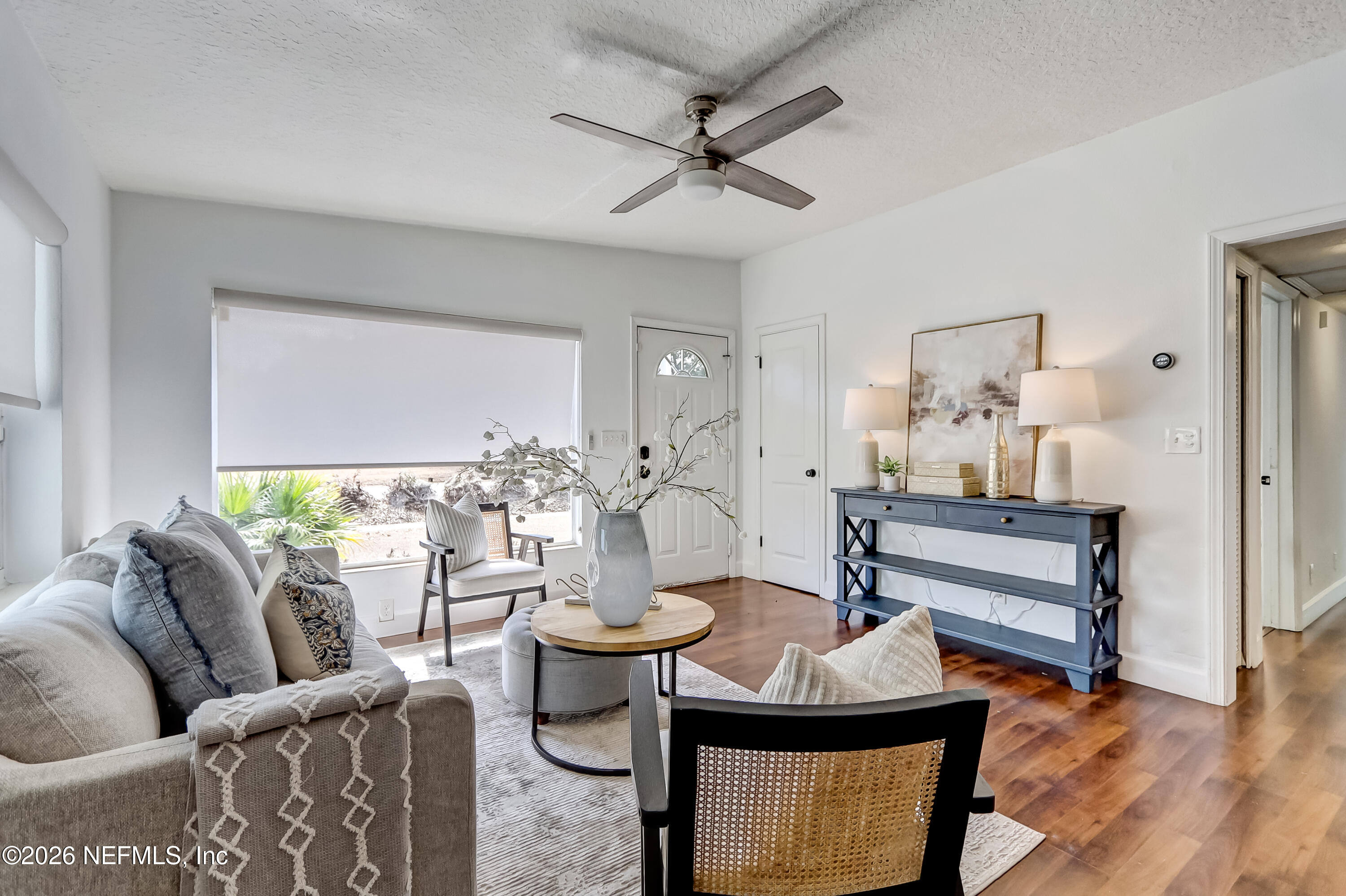 2477 Community Road Jacksonville, FL 32207 - Photo 19 of 33 a living room with furniture and a wooden floor