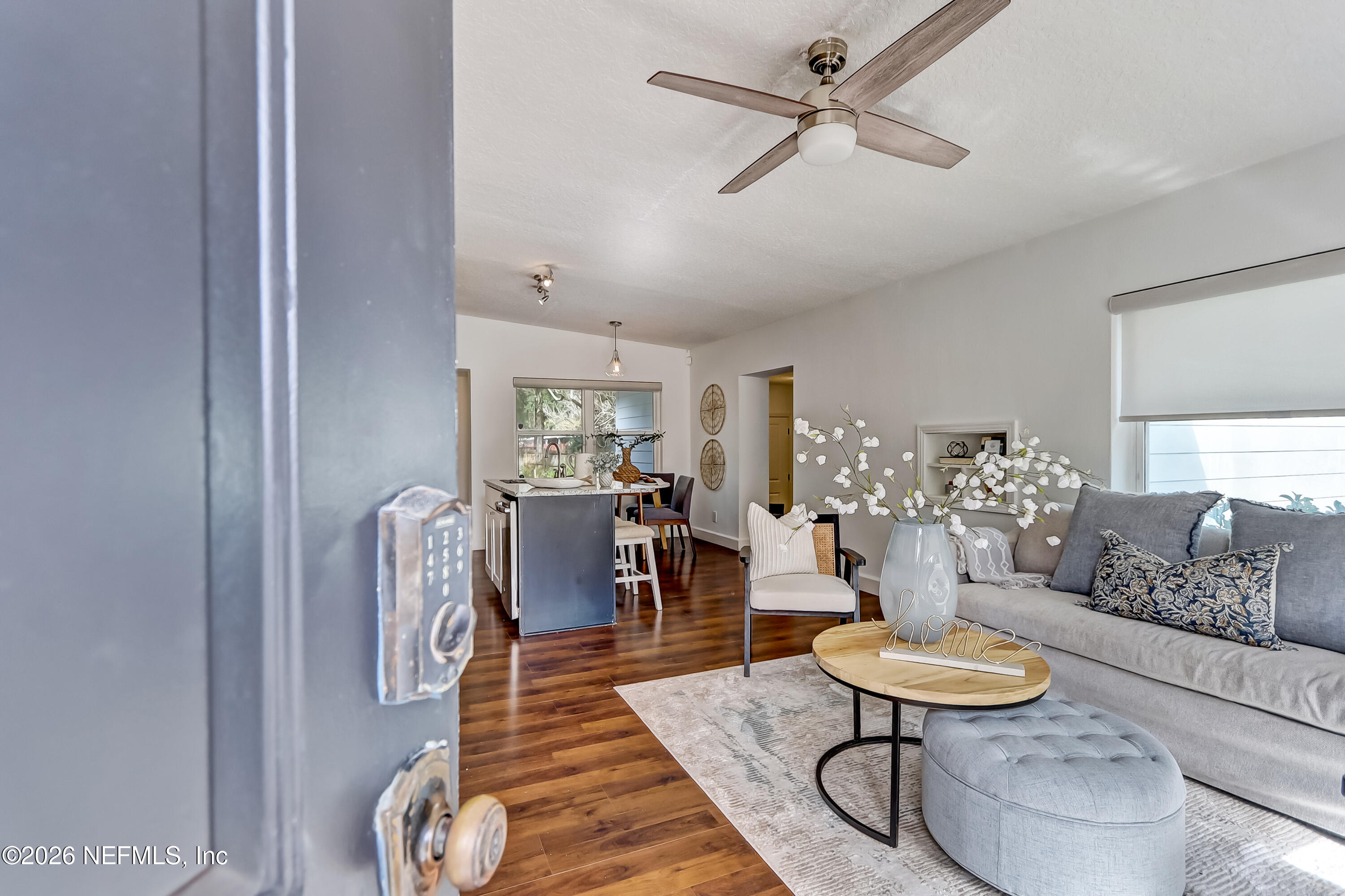 2477 Community Road Jacksonville, FL 32207 - Photo 2 of 33 a living room with furniture and a wooden floor