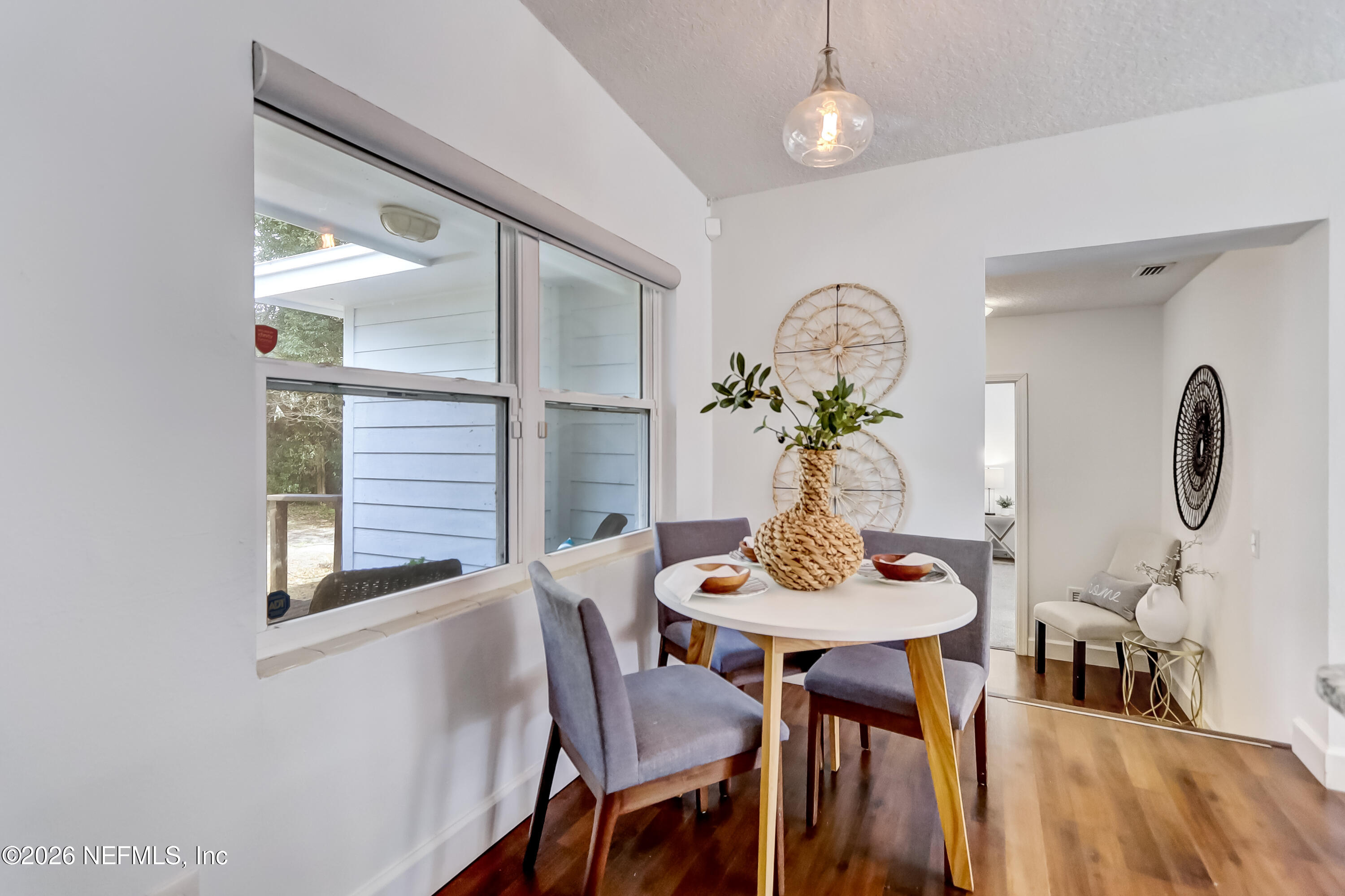 2477 Community Road Jacksonville, FL 32207 - Photo 9 of 33 a view of a dining room with furniture and a chandelier